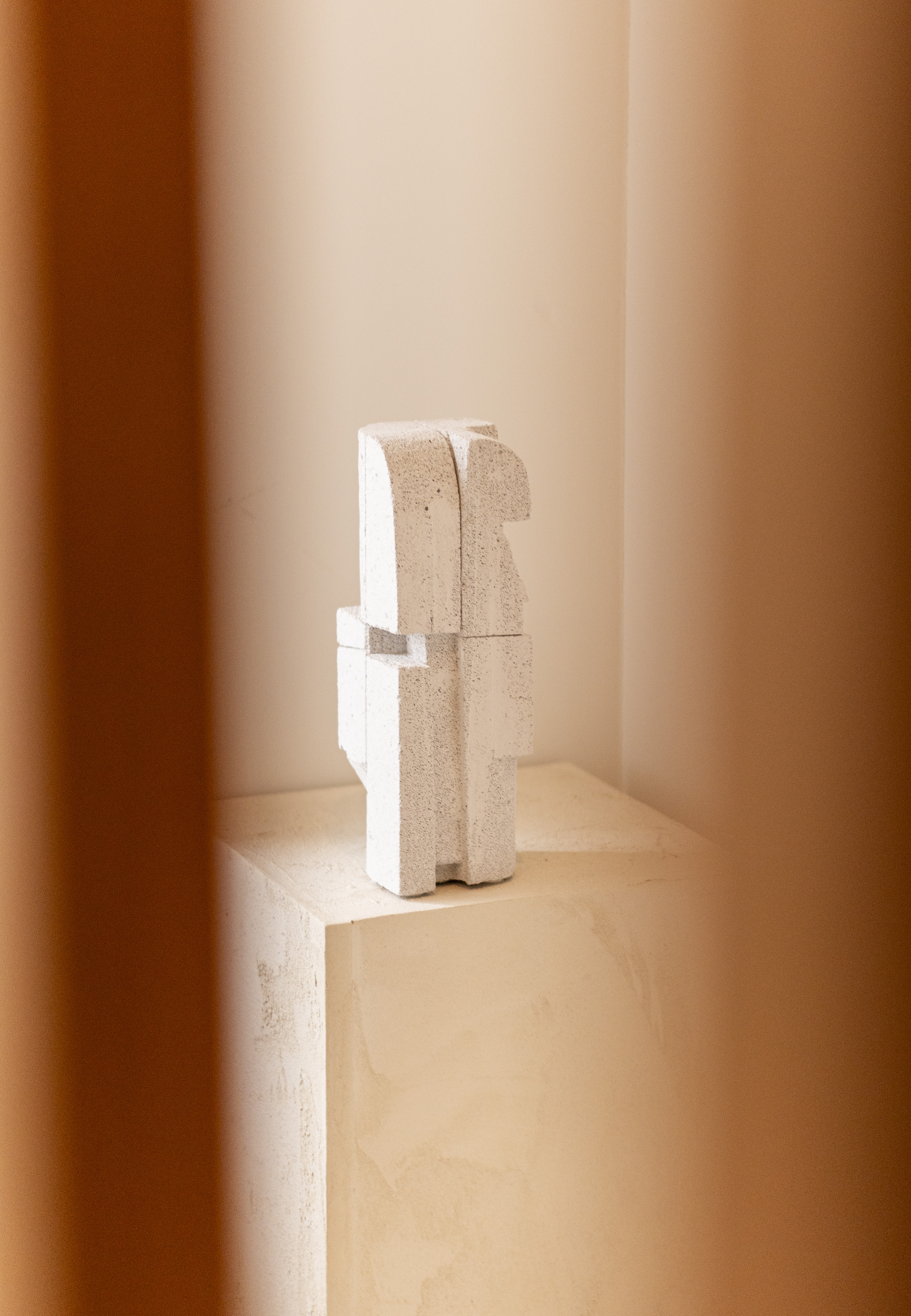 Minimalist Ibiza-inspired textures and architecture, warm beige tones.