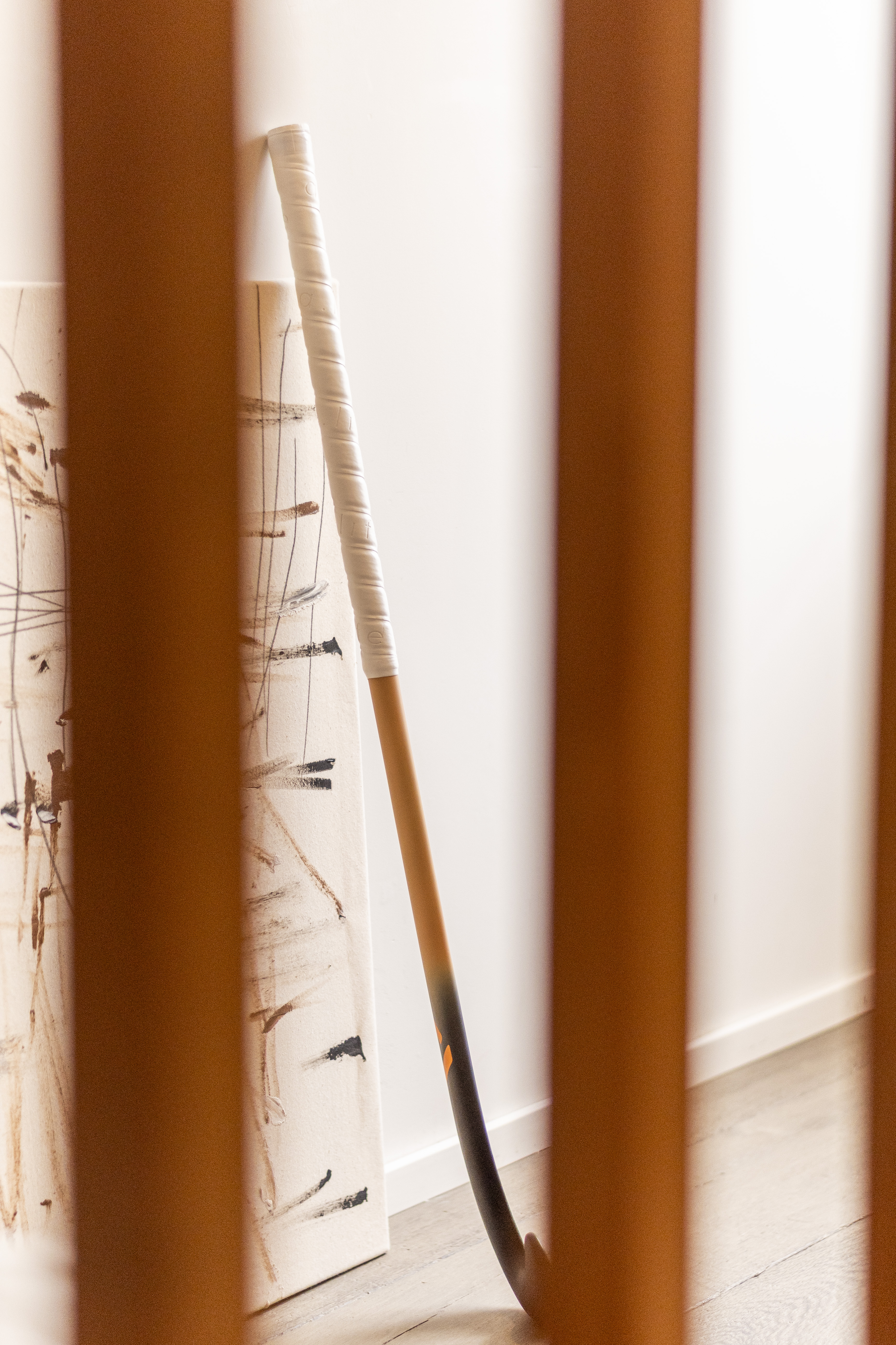Artistic photo of A-LIFE Ibiza Drop hockey stick, inspired by Ibiza architecture and textures.
