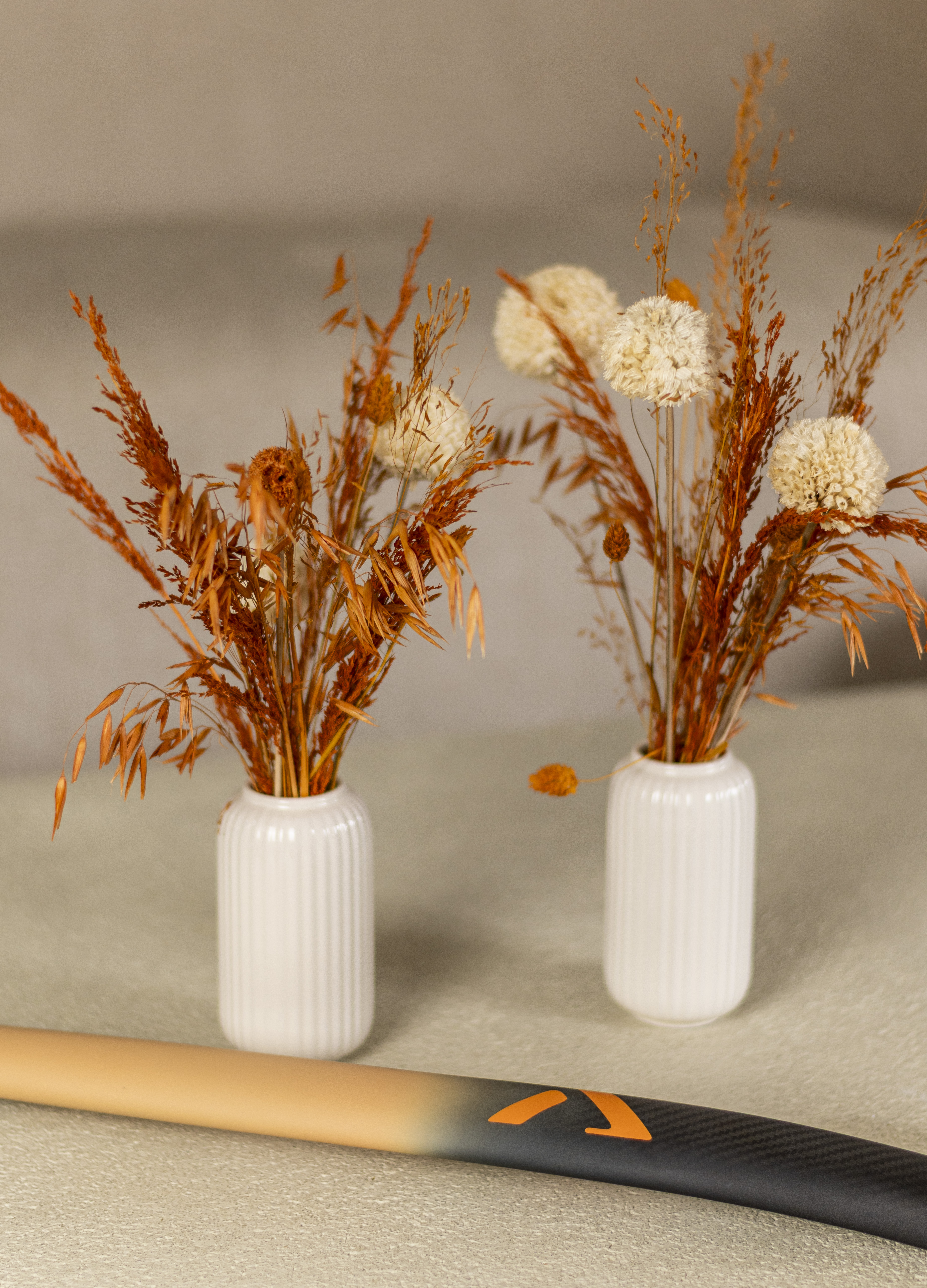 Detail view of A-LIFE hockey stick carbon texture and minimalist logo.